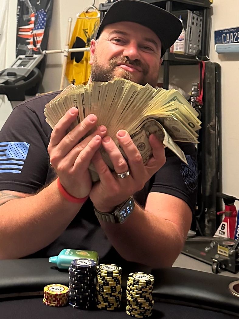Champion holding the cash